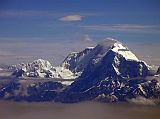 Tibet Kailash 12 Flying From Kathmandu 05 Manaslu  and Peak 29 Peak 29 (7871m, also called Ngadi Chuli) is in the right foreground and just behind, separated by clouds, is Manaslu (8163m), the eight highest mountain in the world.